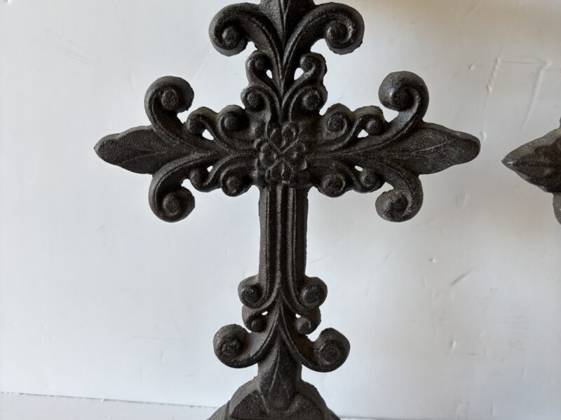 Pair of ornate Fleur de lis cast iron cross candle holders