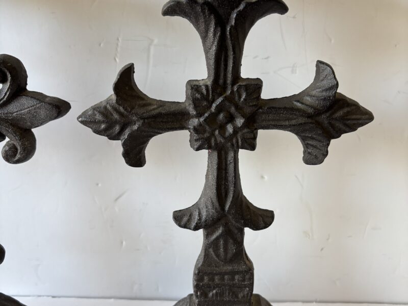 Pair of ornate Fleur de lis cast iron cross candle holders