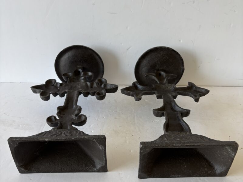 Pair of ornate Fleur de lis cast iron cross candle holders
