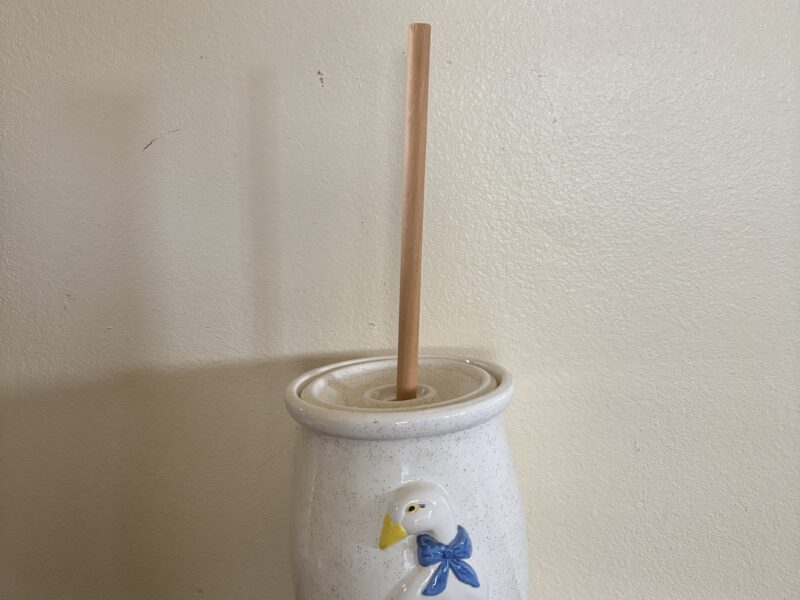 Vintage butter churn with embossed geese highlight decoration