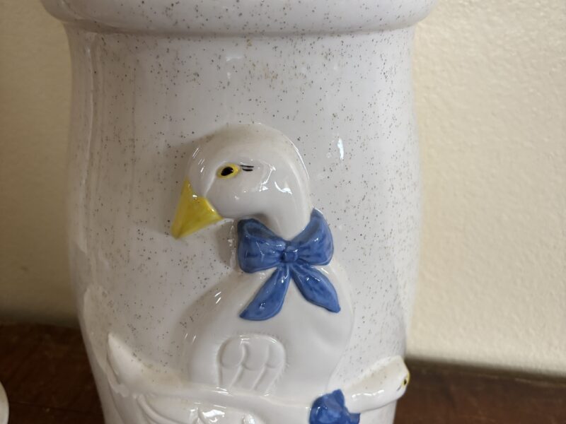 Vintage butter churn with embossed geese highlight decoration