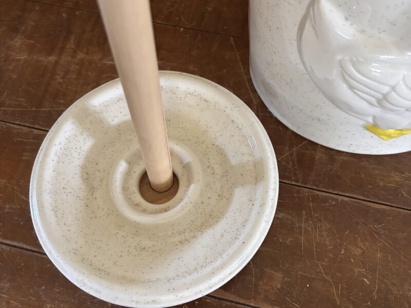 Vintage butter churn with embossed geese highlight decoration