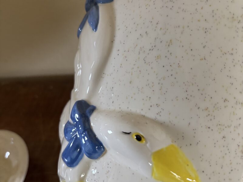 Vintage butter churn with embossed geese highlight decoration