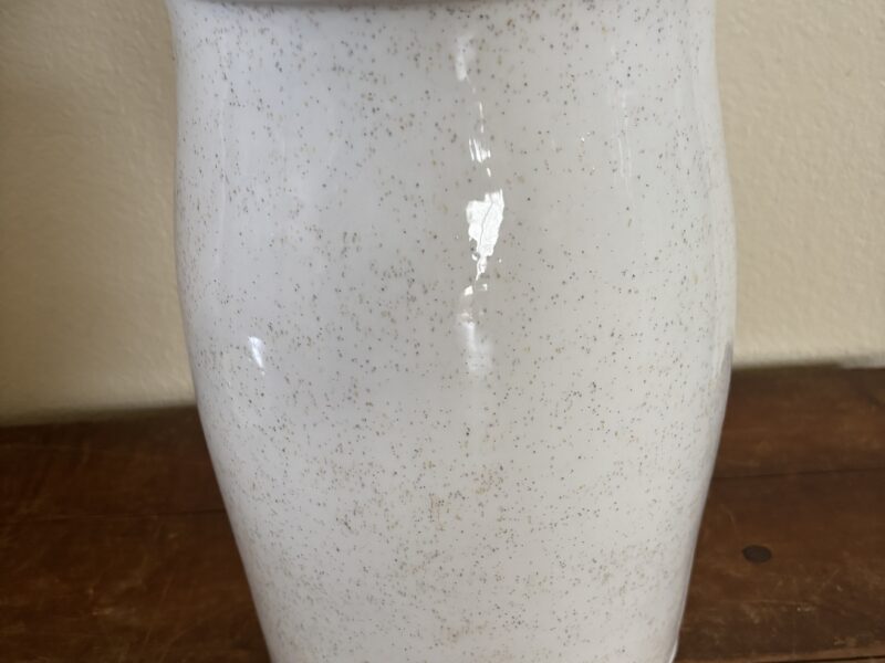 Vintage butter churn with embossed geese highlight decoration