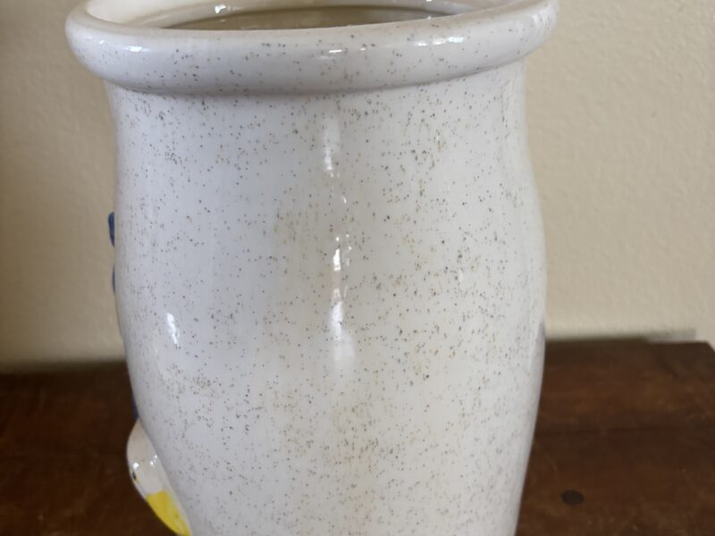 Vintage butter churn with embossed geese highlight decoration