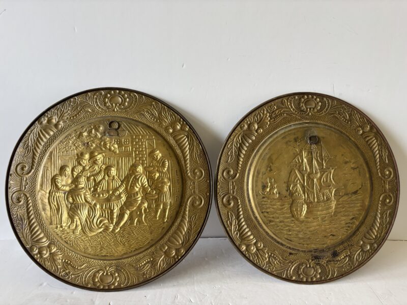 Pair of vintage 14" English Hammered Brass plates at dinner table and sailing ship