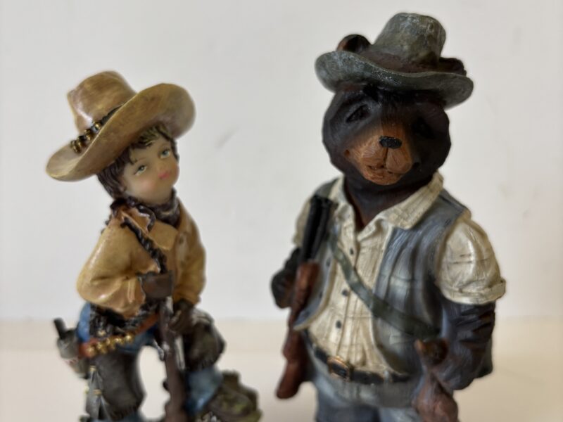 Cowgirl and Bear with a Gun figurines