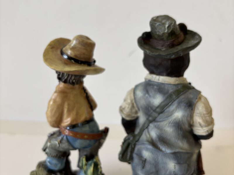 Cowgirl and Bear with a Gun figurines
