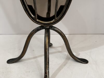 Tall footed metal candle holder with glass