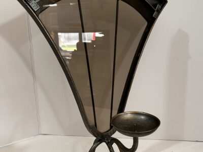 Tall footed metal candle holder with glass