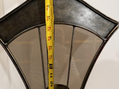 Tall footed metal candle holder with glass