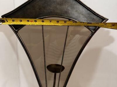 Tall footed metal candle holder with glass