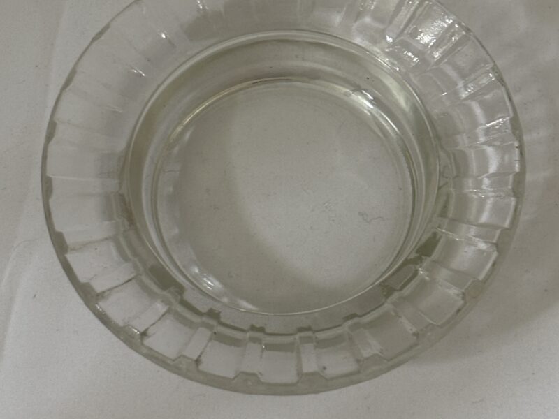Round glass ashtray with fluted rim marked