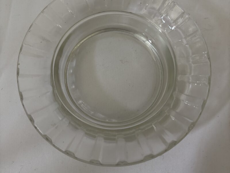 Round glass ashtray with fluted rim marked