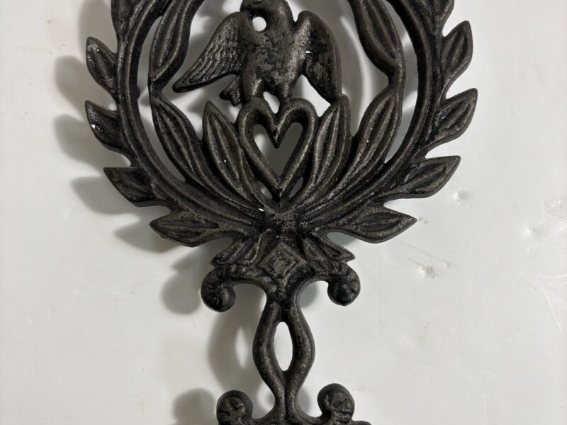 Vintage cast iron trivet with eagle