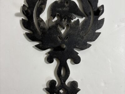 Vintage cast iron trivet with eagle
