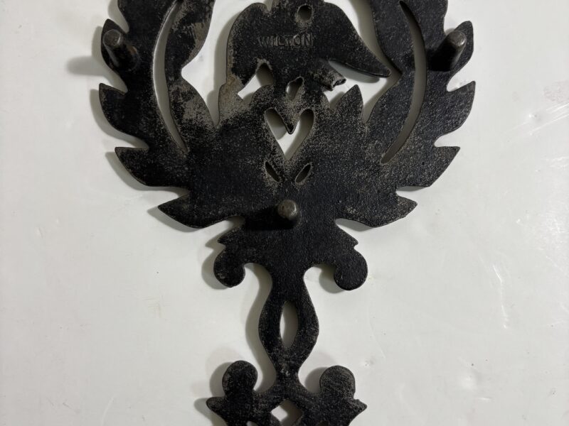 Vintage cast iron trivet with eagle